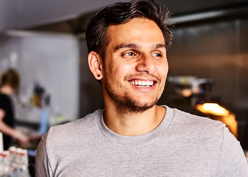 Dr Amit Tewari smiling in one of his venues